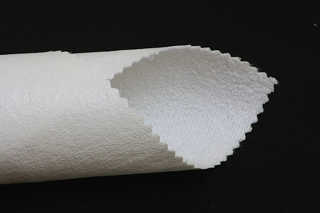 Przekrój białego laminowanego materiału tekstylnego Wamatex